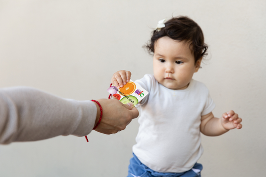 baby holding WIC Card